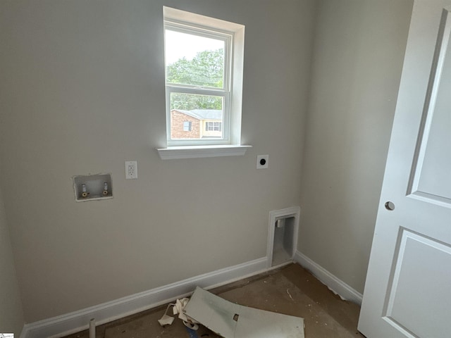 clothes washing area with baseboards, hookup for an electric dryer, hookup for a washing machine, and laundry area
