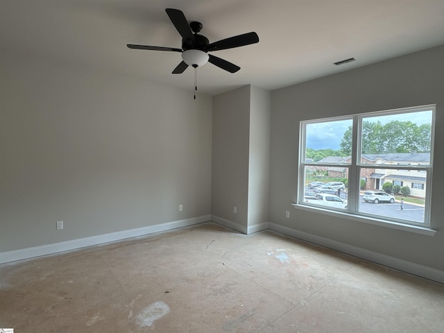 spare room with visible vents, baseboards, and ceiling fan