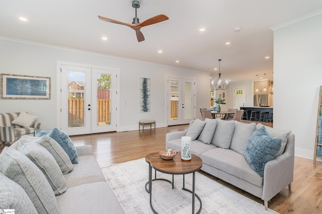 827 S Academy St, Greenville, SC 29601 - living room with recessed lighting, crown molding, light wood finished floors, and french doors