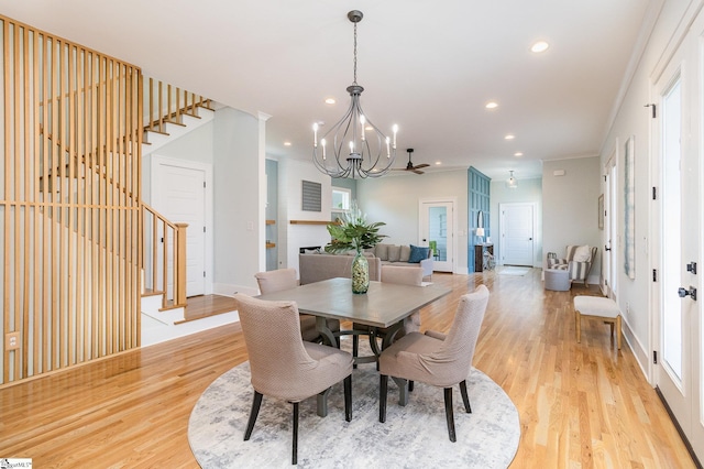 827 S Academy St, Greenville, SC 29601 - dining area featuring stairway, light wood-style flooring, and a notable chandelier