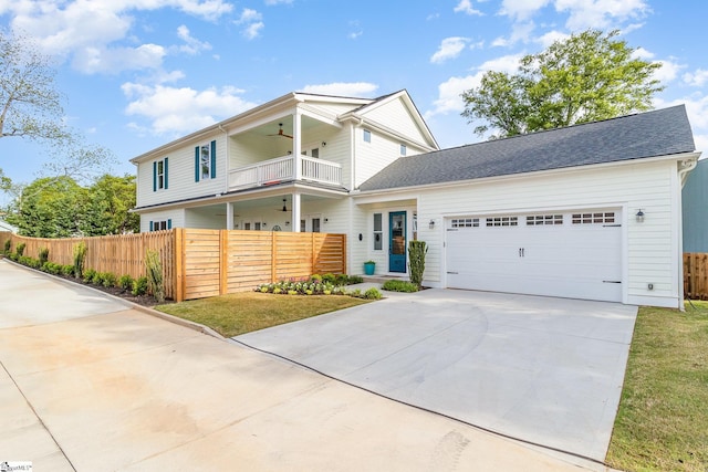 827 S Academy St, Greenville, SC 29601 - view of front facade with fence, driveway, a balcony, and a garage