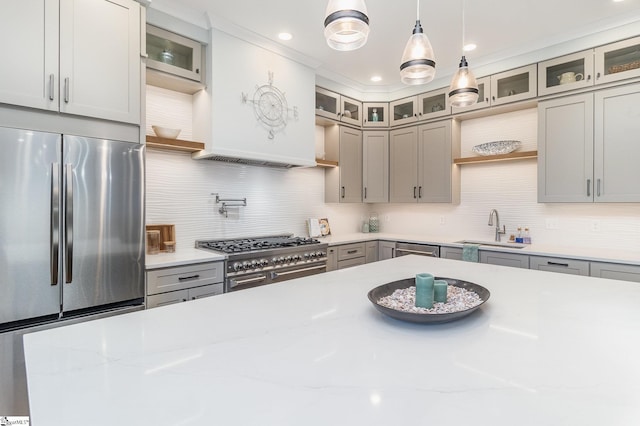 827 S Academy St, Greenville, SC 29601 - kitchen featuring appliances with stainless steel finishes, pendant lighting, decorative backsplash, and a sink