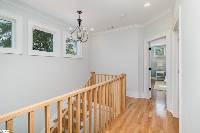 827 S Academy St, Greenville, SC 29601 - corridor with light wood finished floors, a notable chandelier, a wealth of natural light, and an upstairs landing