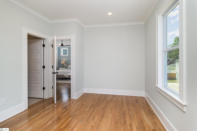 827 S Academy St, Greenville, SC 29601 - empty room with baseboards, crown molding, and light wood-style floors