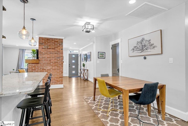 dining room featuring recessed lighting, light wood-style floors, visible vents, and baseboards