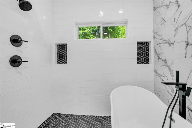 full bathroom featuring tiled shower
