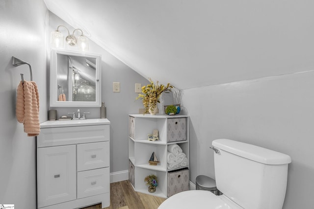 108A Holt Dr, Iva, SC 29655 - half bath with lofted ceiling, wood finished floors, vanity, and toilet