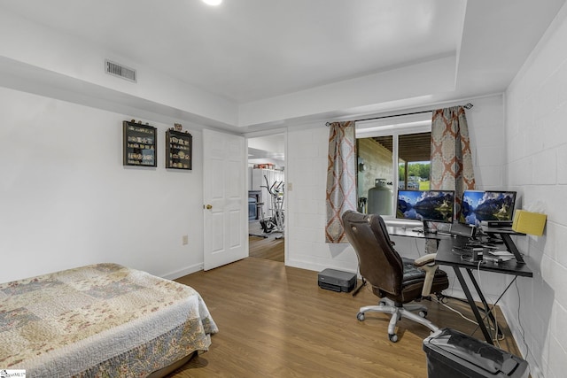 108A Holt Dr, Iva, SC 29655 - bedroom with concrete block wall, wood finished floors, and visible vents