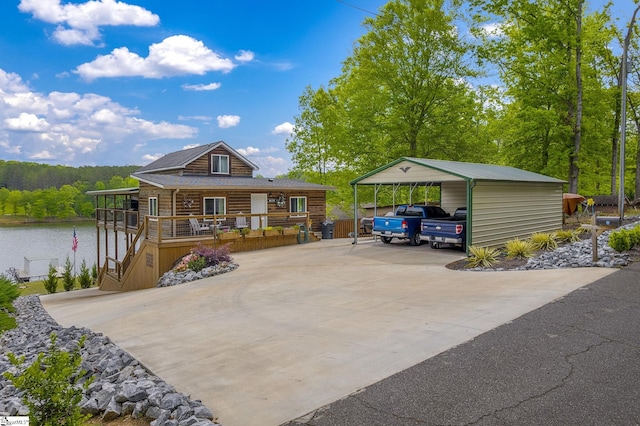 108A Holt Dr, Iva, SC 29655 - exterior space with stairway, driveway, a water view, a view of trees, and a detached carport