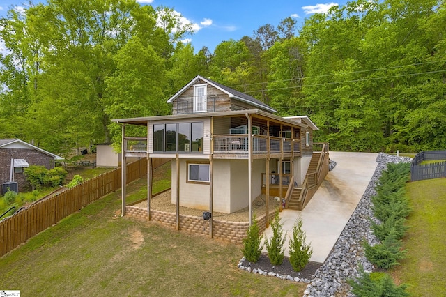 108A Holt Dr, Iva, SC 29655 - back of property featuring a fenced backyard, a patio, a deck, and stairs