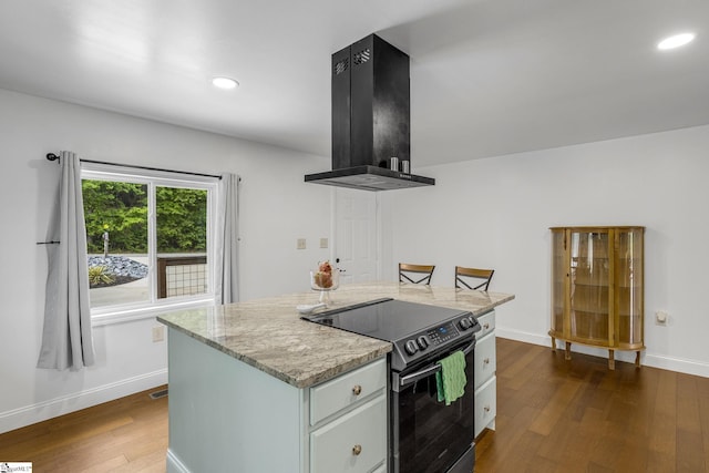 108A Holt Dr, Iva, SC 29655 - kitchen with range with electric cooktop, dark wood-style flooring, baseboards, recessed lighting, and a kitchen island