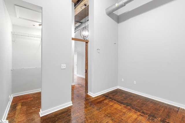 interior space featuring attic access and wood-type flooring