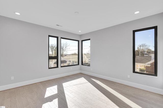 512 Anderson St Unit 1, Greenville, SC 29601 - empty room with baseboards, recessed lighting, visible vents, and light wood-type flooring