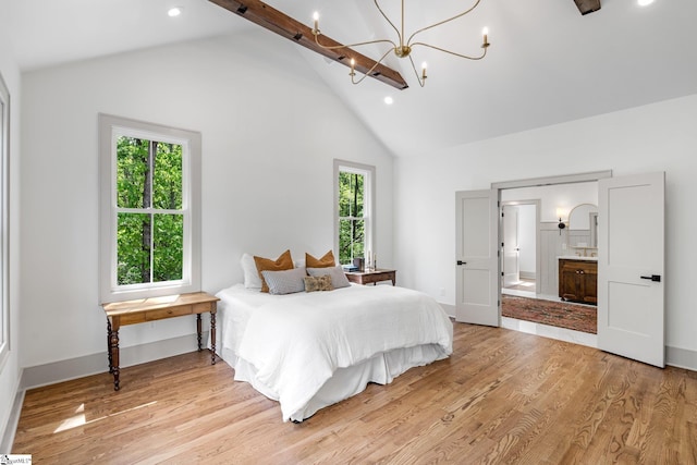 bedroom featuring high vaulted ceiling, a notable chandelier, multiple windows, and light wood-type flooring