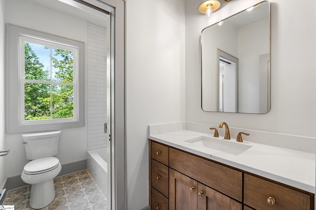 full bathroom featuring baseboards, toilet, and vanity