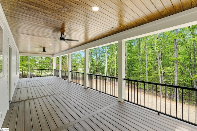 wooden terrace featuring a ceiling fan