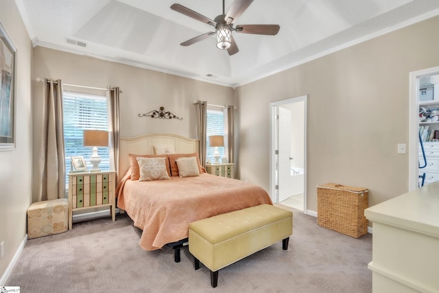 bedroom with ceiling fan, light carpet, ensuite bath, ornamental molding, and visible vents