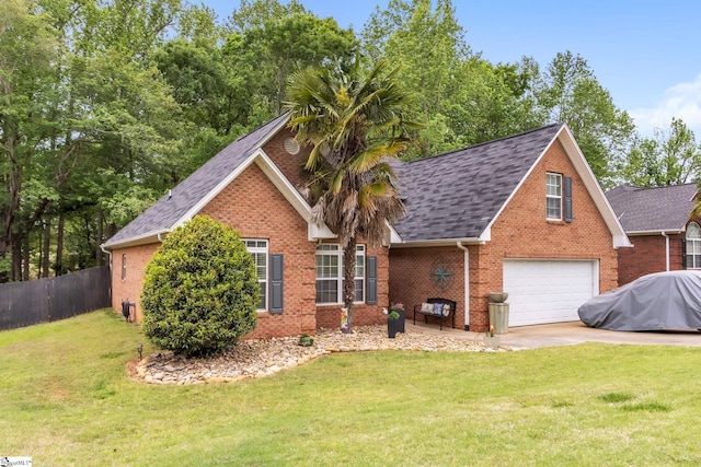 view of front facade with brick siding, an attached garage, fence, and roof with shingles