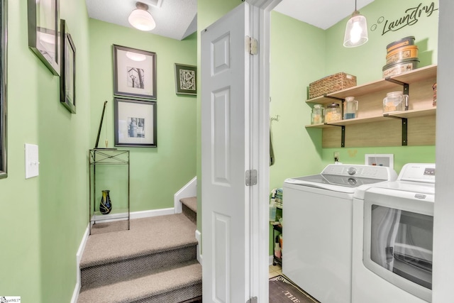 laundry room featuring baseboards and washer and clothes dryer