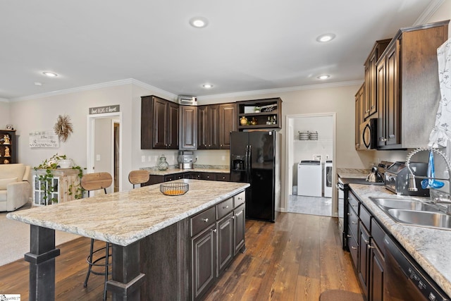kitchen featuring black refrigerator with ice dispenser, stainless steel stove, a sink, dark wood-type flooring, and dishwashing machine