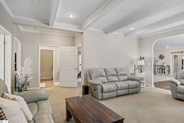 living area featuring arched walkways, ornamental molding, beamed ceiling, and recessed lighting
