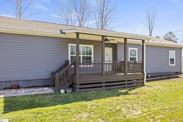 rear view of house with a lawn, a ceiling fan, covered porch, and crawl space