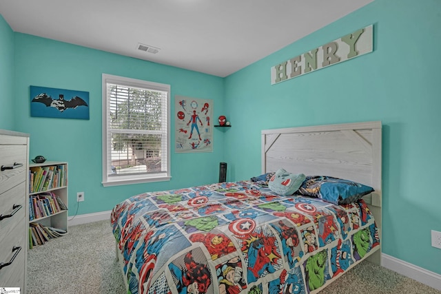 bedroom with carpet, visible vents, and baseboards