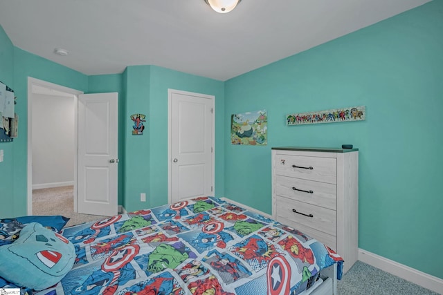 bedroom featuring baseboards and light colored carpet