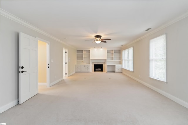 unfurnished living room featuring a fireplace, ceiling fan, baseboards, and ornamental molding