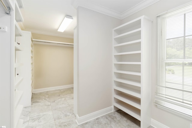 walk in closet with marble finish floor