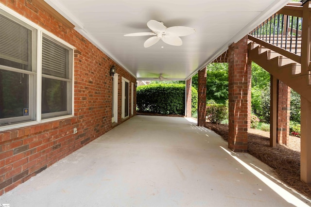 view of patio / terrace with stairway, a ceiling fan, and covered porch