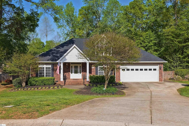 view of front of property with fence, a front lawn, driveway, and brick siding