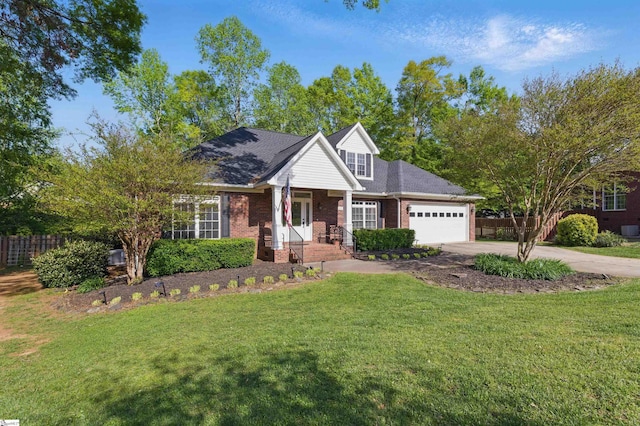 view of front of property featuring fence, concrete driveway, an attached garage, brick siding, and a front yard