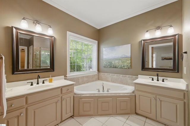 full bath featuring tile patterned flooring, a garden tub, a sink, and two vanities