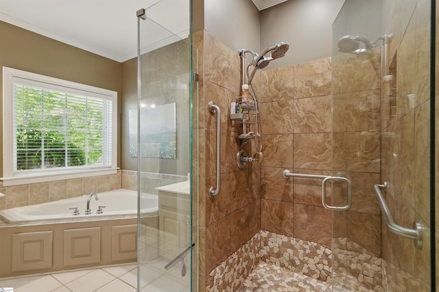 bathroom with a shower stall, a garden tub, and ornamental molding
