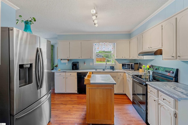 kitchen with black appliances, under cabinet range hood, crown molding, and a textured ceiling