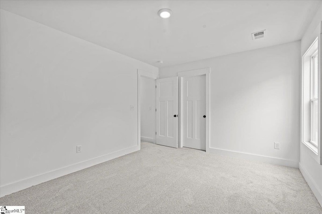407 Briggs Dr, Easley, SC 29642 - carpeted spare room with plenty of natural light and baseboards