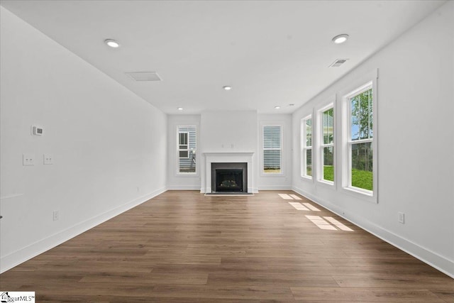 407 Briggs Dr, Easley, SC 29642 - unfurnished living room featuring a fireplace, wood finished floors, recessed lighting, and baseboards