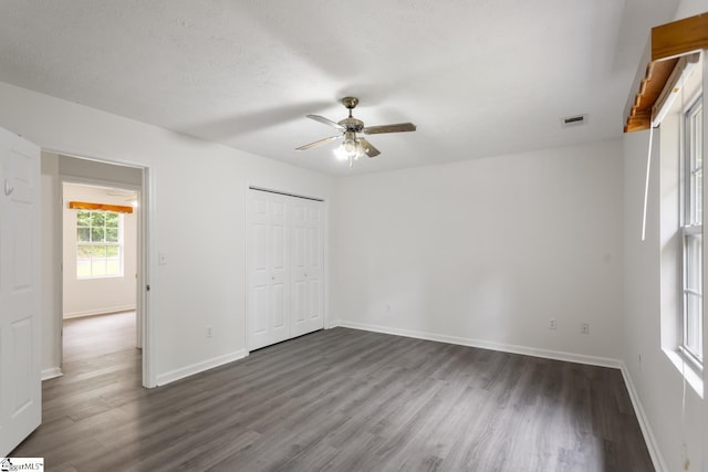 123 Sequayah Dr, Fair Play, SC 29643 - unfurnished bedroom with dark wood finished floors, baseboards, and a closet