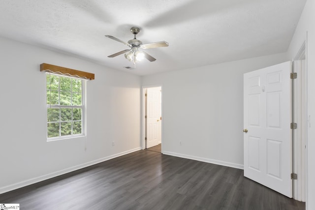 123 Sequayah Dr, Fair Play, SC 29643 - unfurnished bedroom with dark wood-type flooring, baseboards, and a ceiling fan
