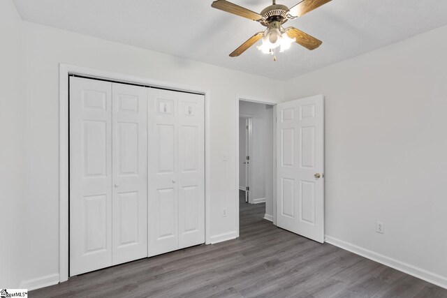 123 Sequayah Dr, Fair Play, SC 29643 - unfurnished bedroom featuring wood finished floors, baseboards, and a closet