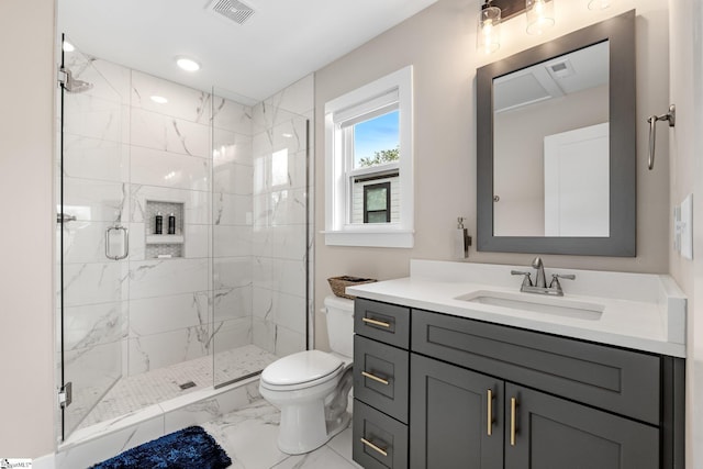 bathroom featuring toilet, visible vents, marble finish floor, a shower stall, and vanity