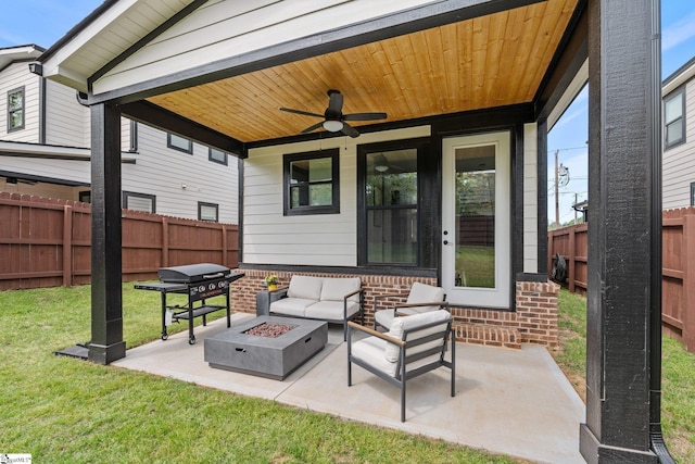view of patio featuring a ceiling fan, an outdoor living space with a fire pit, a fenced backyard, and a grill