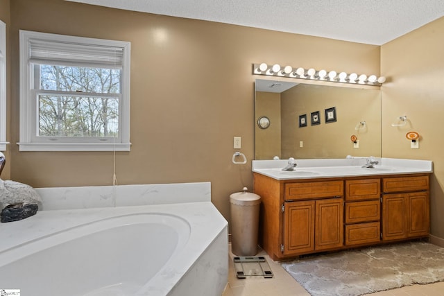full bathroom with a bath, tile patterned flooring, a sink, and double vanity