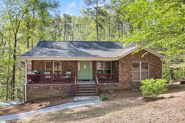 112 Jocassee Falls Rd, Salem, SC 29676 - ranch-style house with brick siding, a porch, and a shingled roof