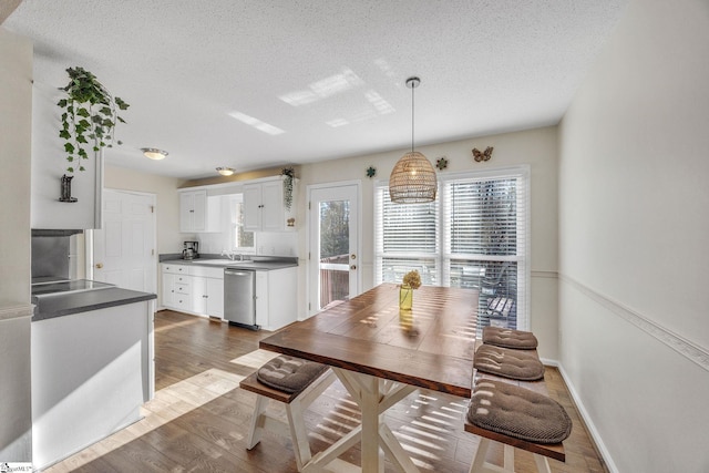 112 Jocassee Falls Rd, Salem, SC 29676 - dining area with wood finished floors, a textured ceiling, and baseboards