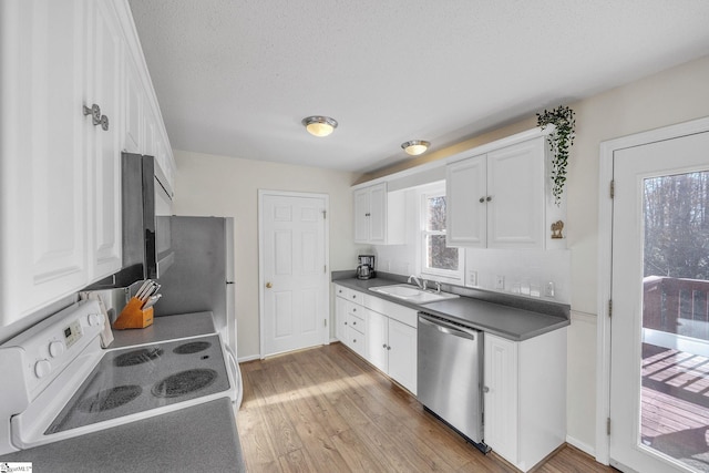 112 Jocassee Falls Rd, Salem, SC 29676 - kitchen with white cabinets, stainless steel dishwasher, electric stove, and light wood finished floors