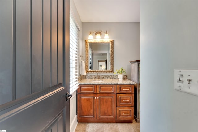 bathroom featuring plenty of natural light and vanity