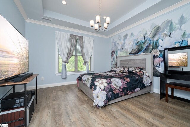 885 Affirmed Dr, Boiling Springs, SC 29316 - bedroom featuring baseboards, visible vents, a notable chandelier, wood finished floors, and a raised ceiling