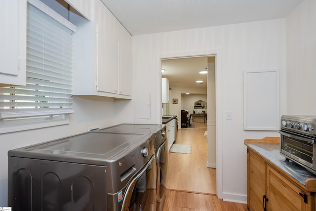409 Freeman Bridge Rd, Marietta, SC 29661 - laundry area featuring separate washer and dryer and light wood finished floors